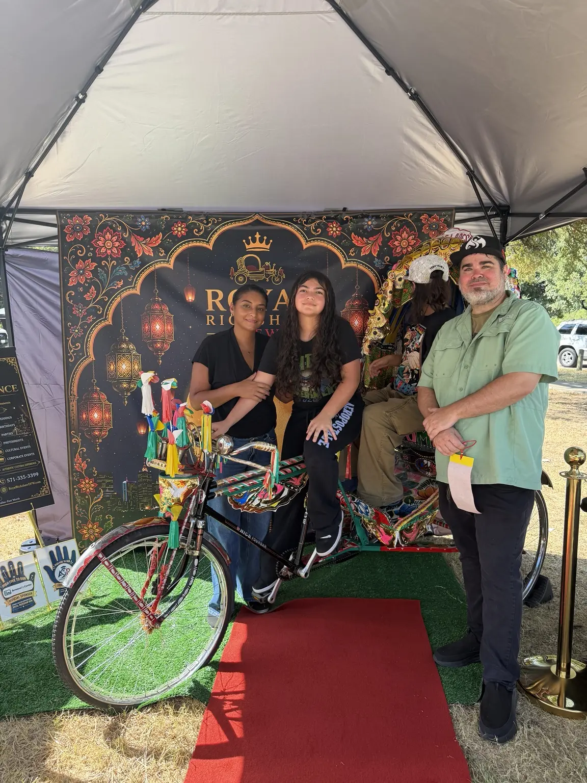 Family portrait with the authentic Royal Rickshaw at the Dallas festival