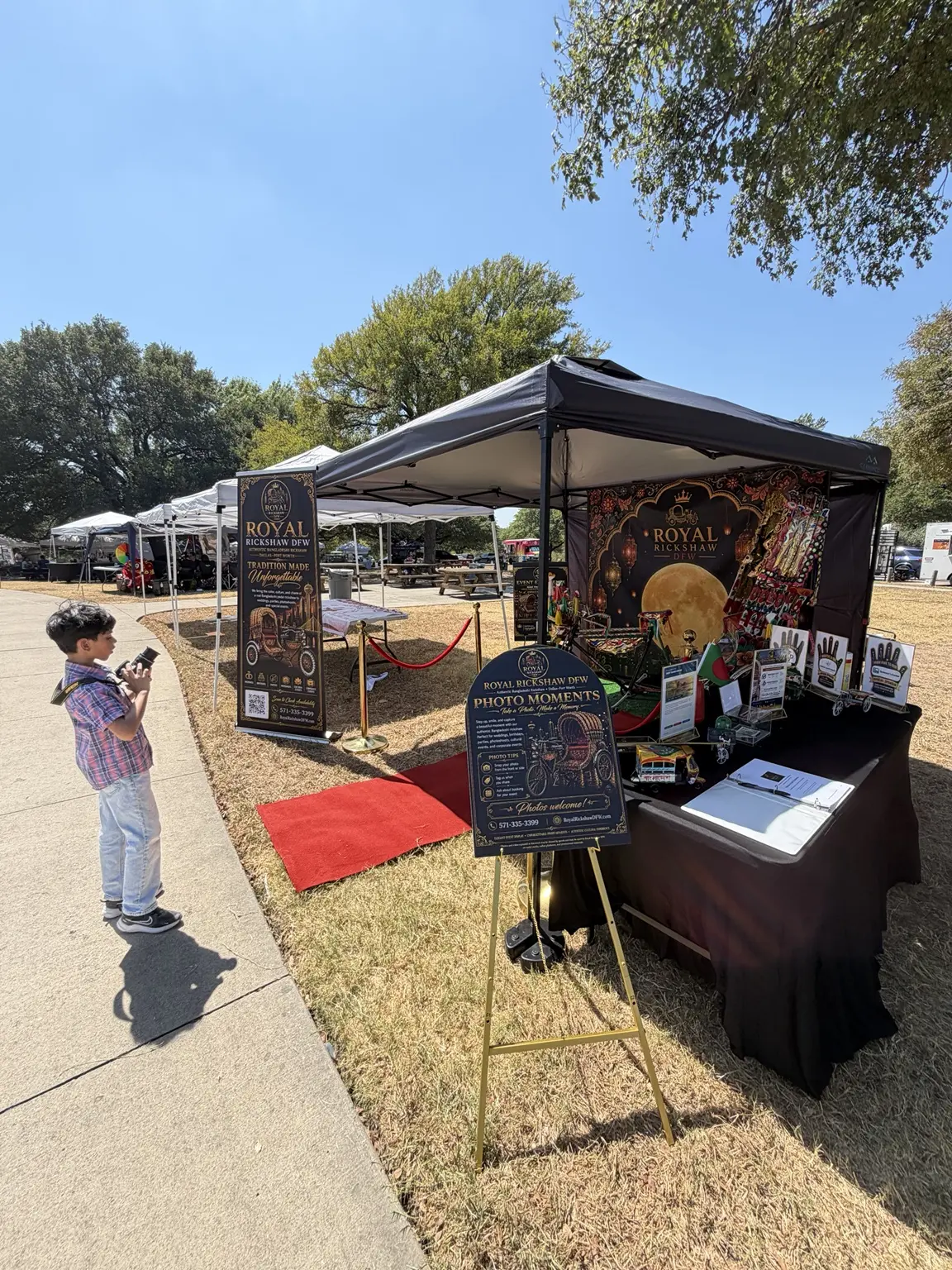 Wide view of the Royal Rickshaw DFW cultural experience booth