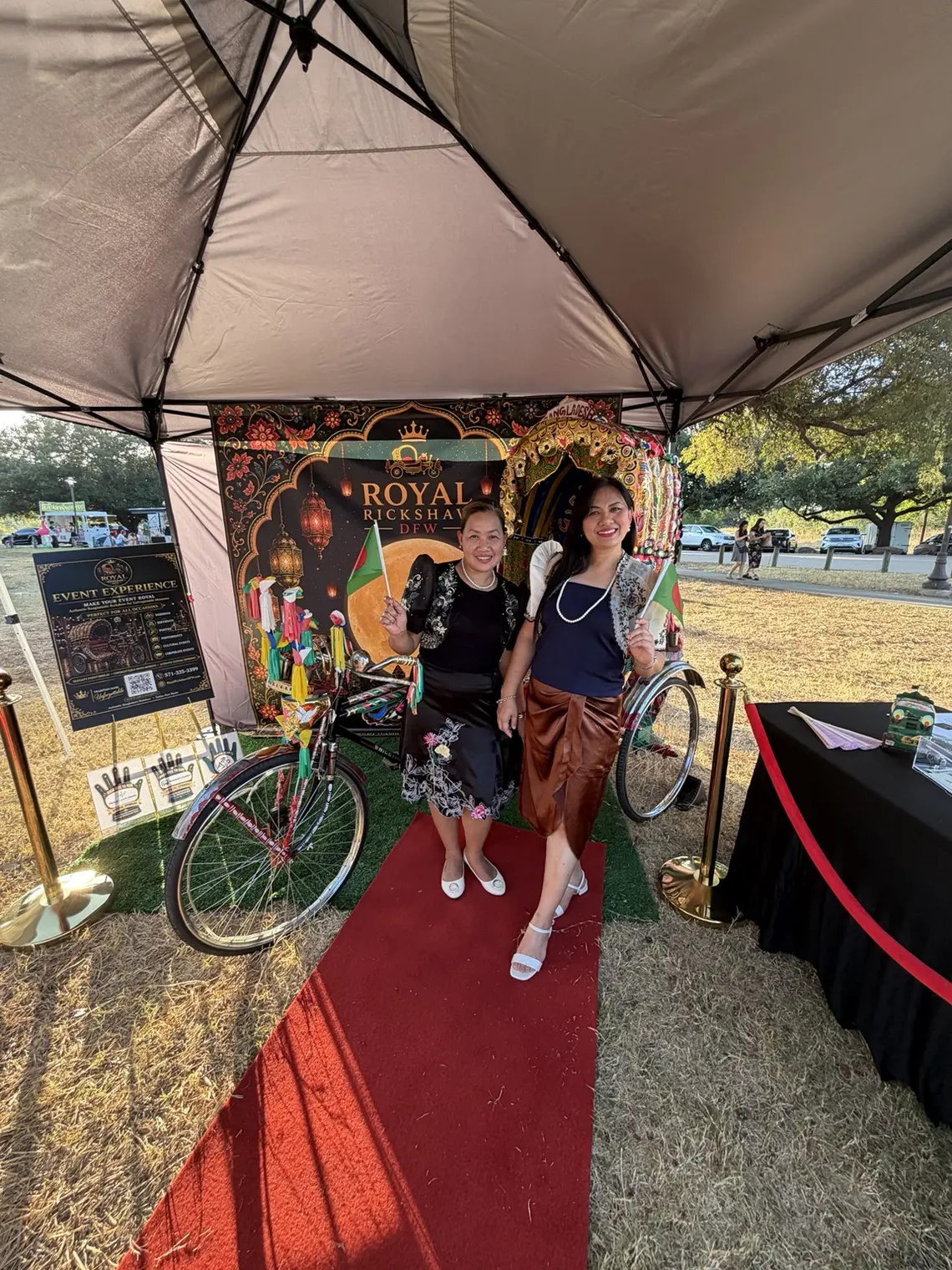 Young festival visitors posing with the Royal Rickshaw DFW display