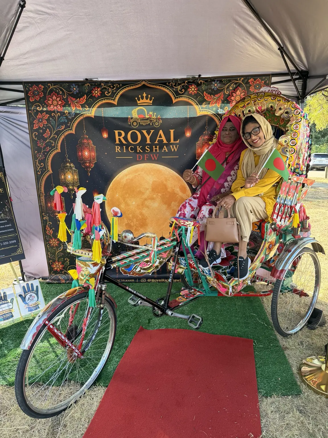 Family members in colorful traditional clothing enjoying the Royal Rickshaw