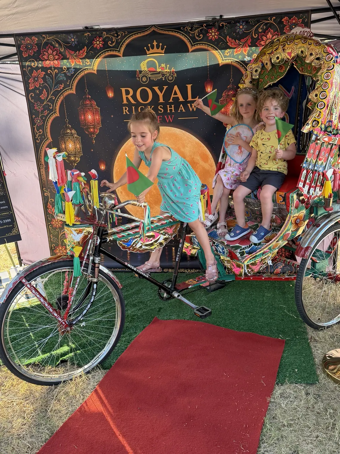 Parent and children enjoying a hands-on Royal Rickshaw cultural experience