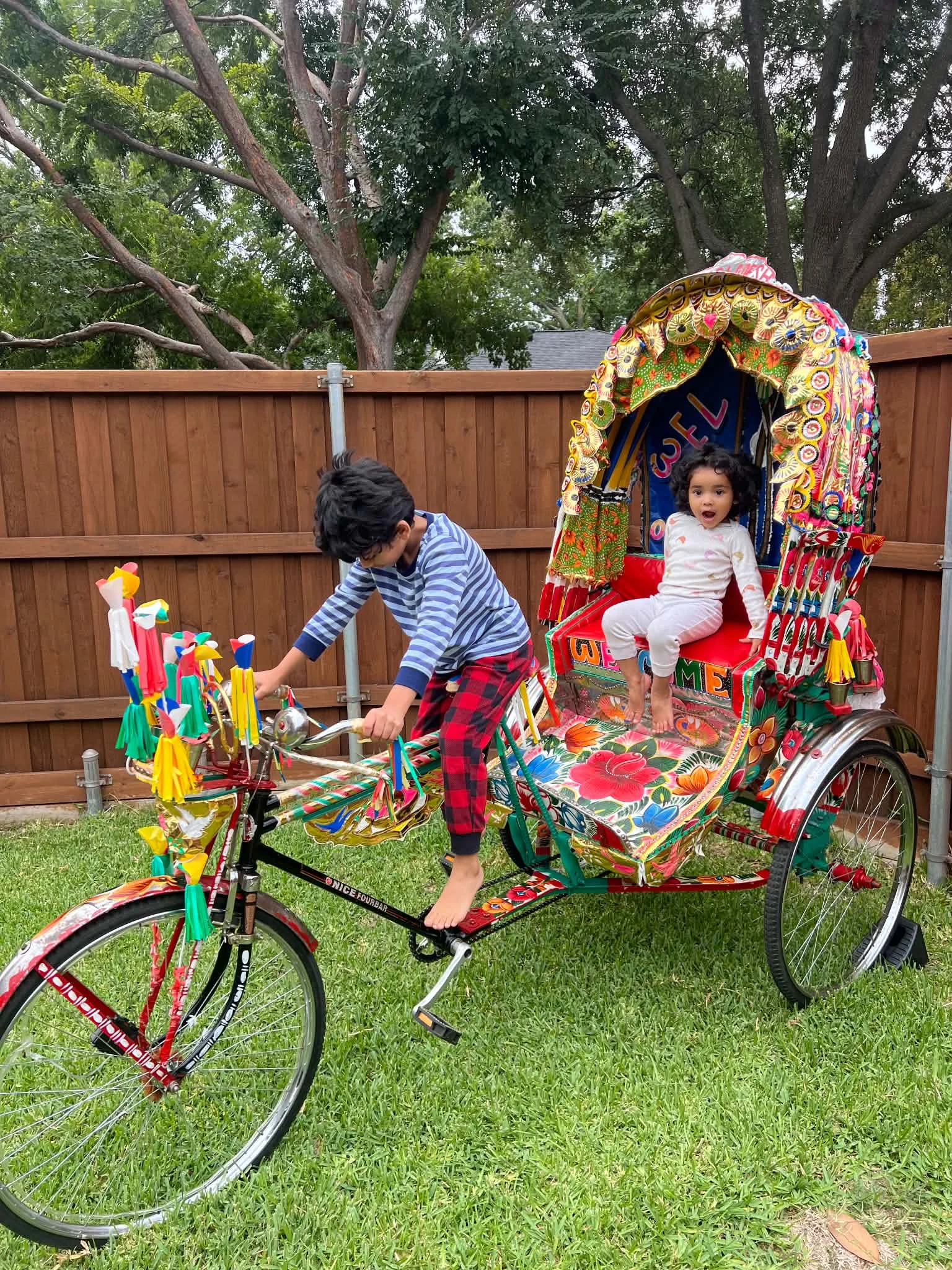 Family experiencing the actual Royal Rickshaw DFW rickshaw