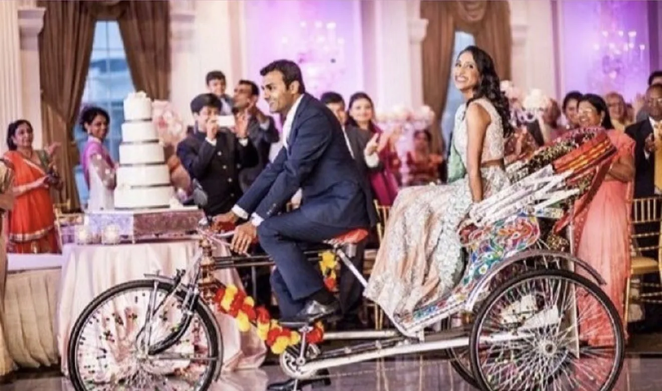 Reference wedding image featuring a couple and a decorated rickshaw