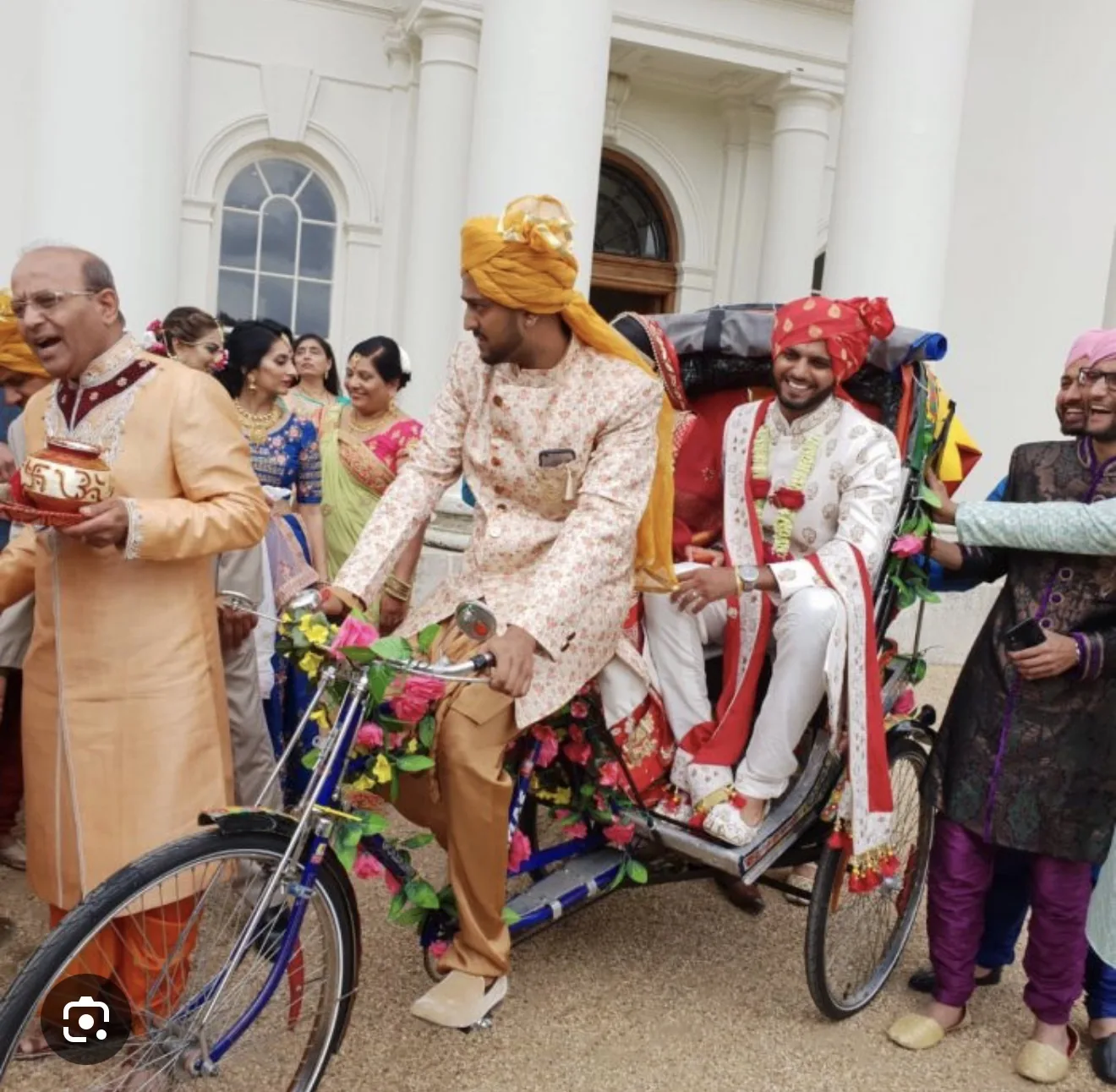 Reference wedding procession image with groom seated in a rickshaw