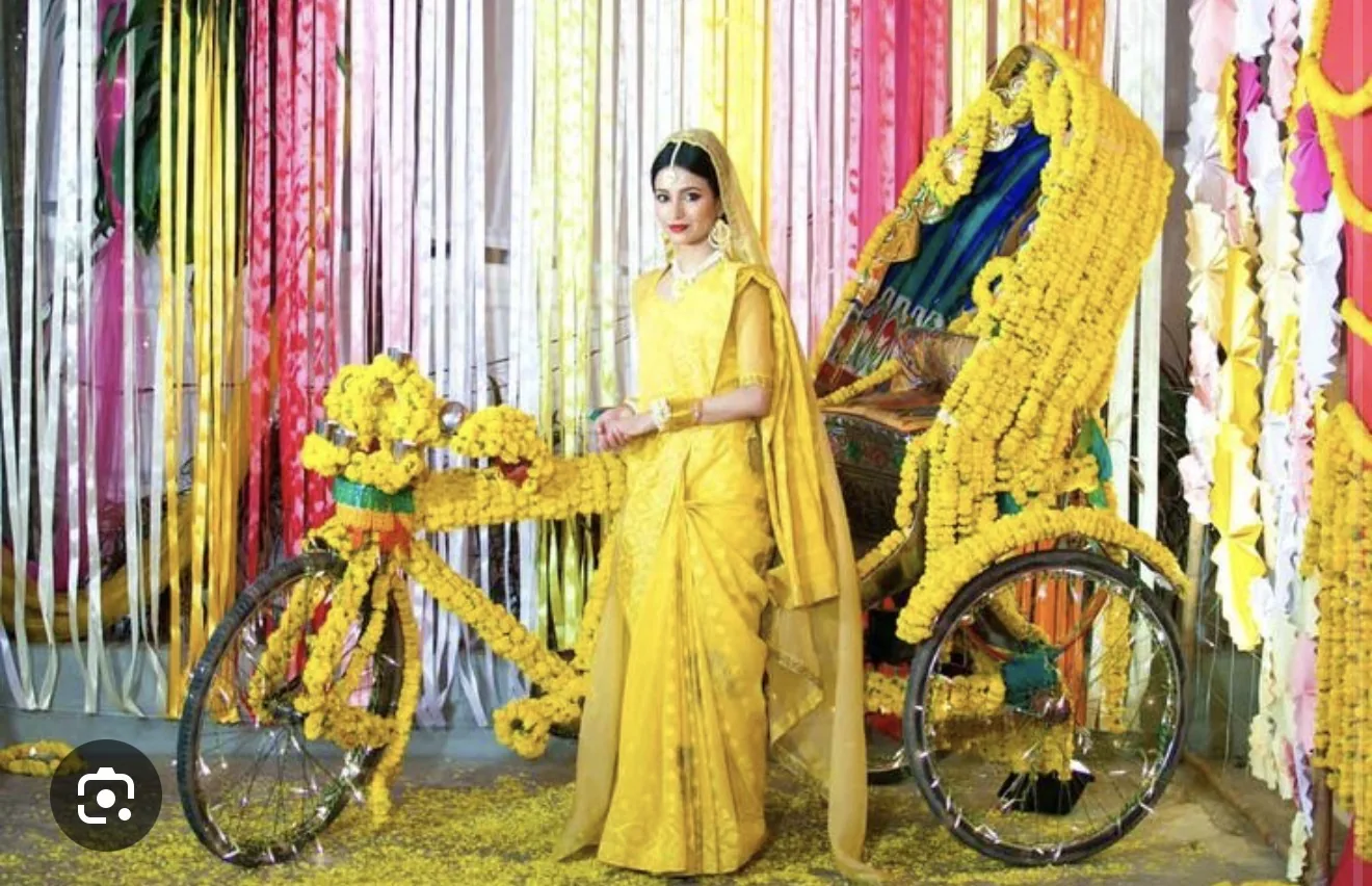 Reference image of a bride beside a marigold-decorated rickshaw